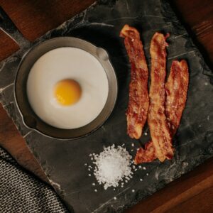 white egg on black plate